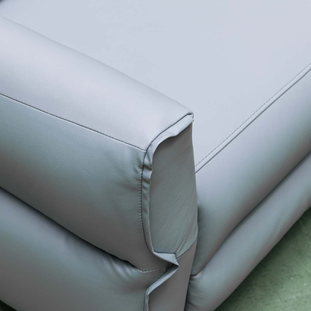 Close-up detail shot showing the premium leather texture and stitching quality for comfort design furniture