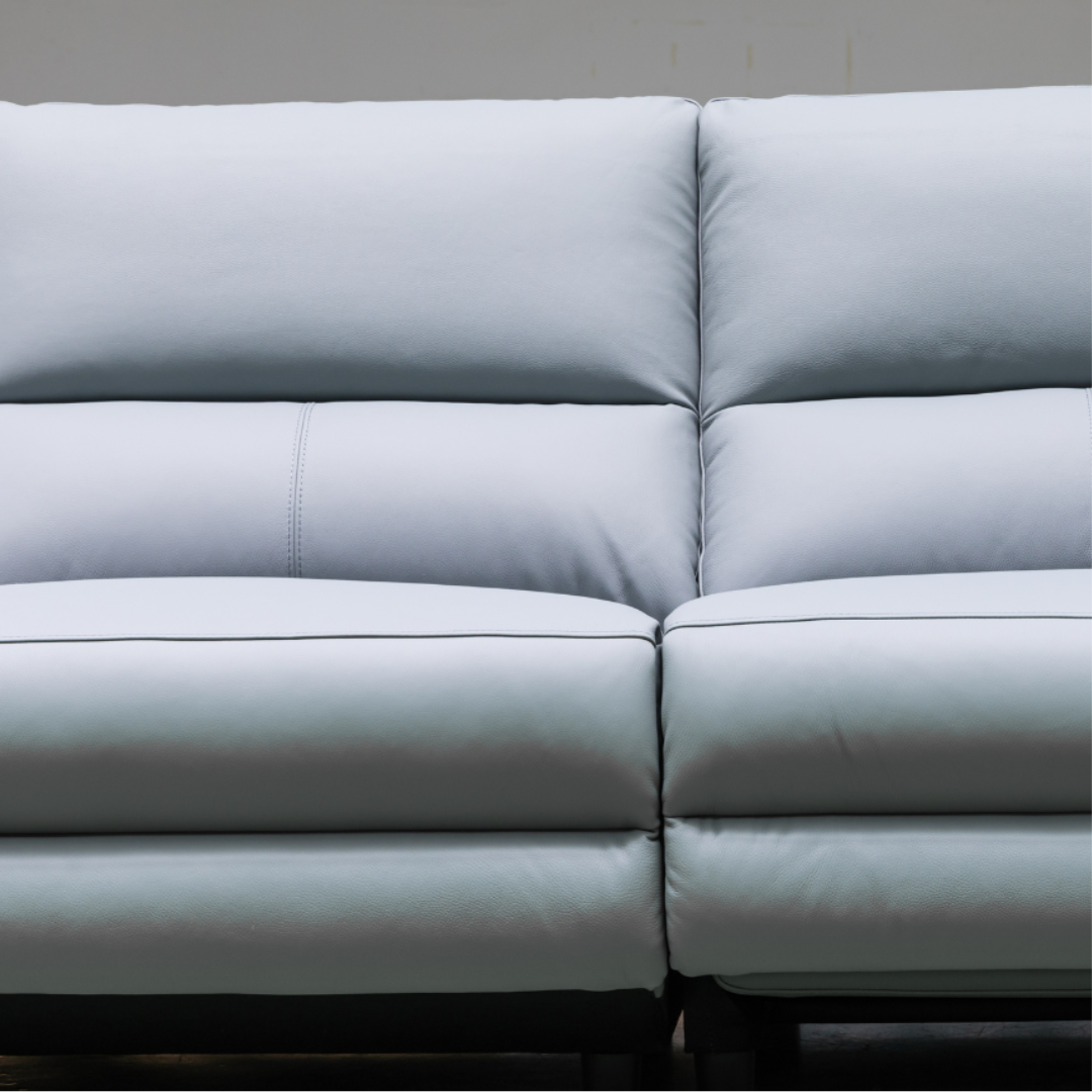 Close-up detail shot showing the premium leather texture and stitching quality for comfort design furniture