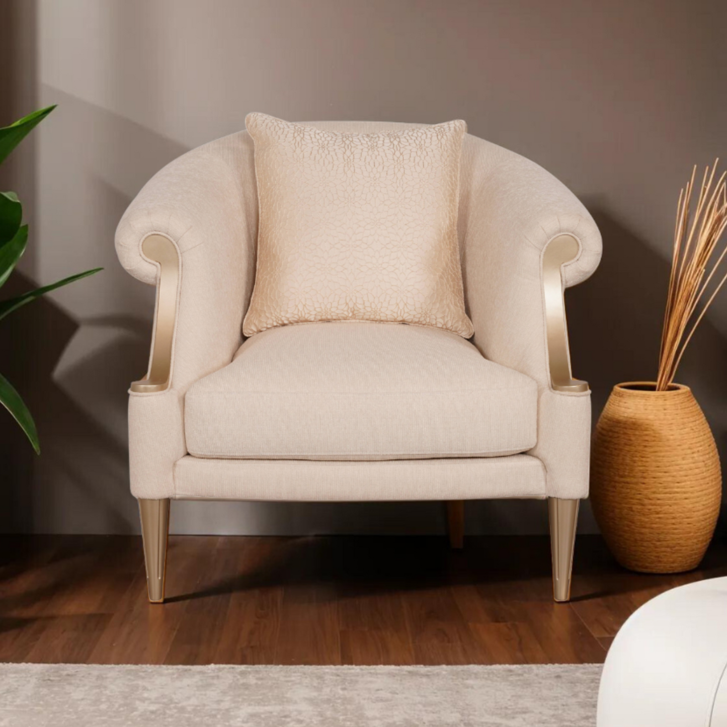 Klaussner Clarkson armchair with curved rolled arms, upholstered in soft beige fabric, featuring a matching textured cushion