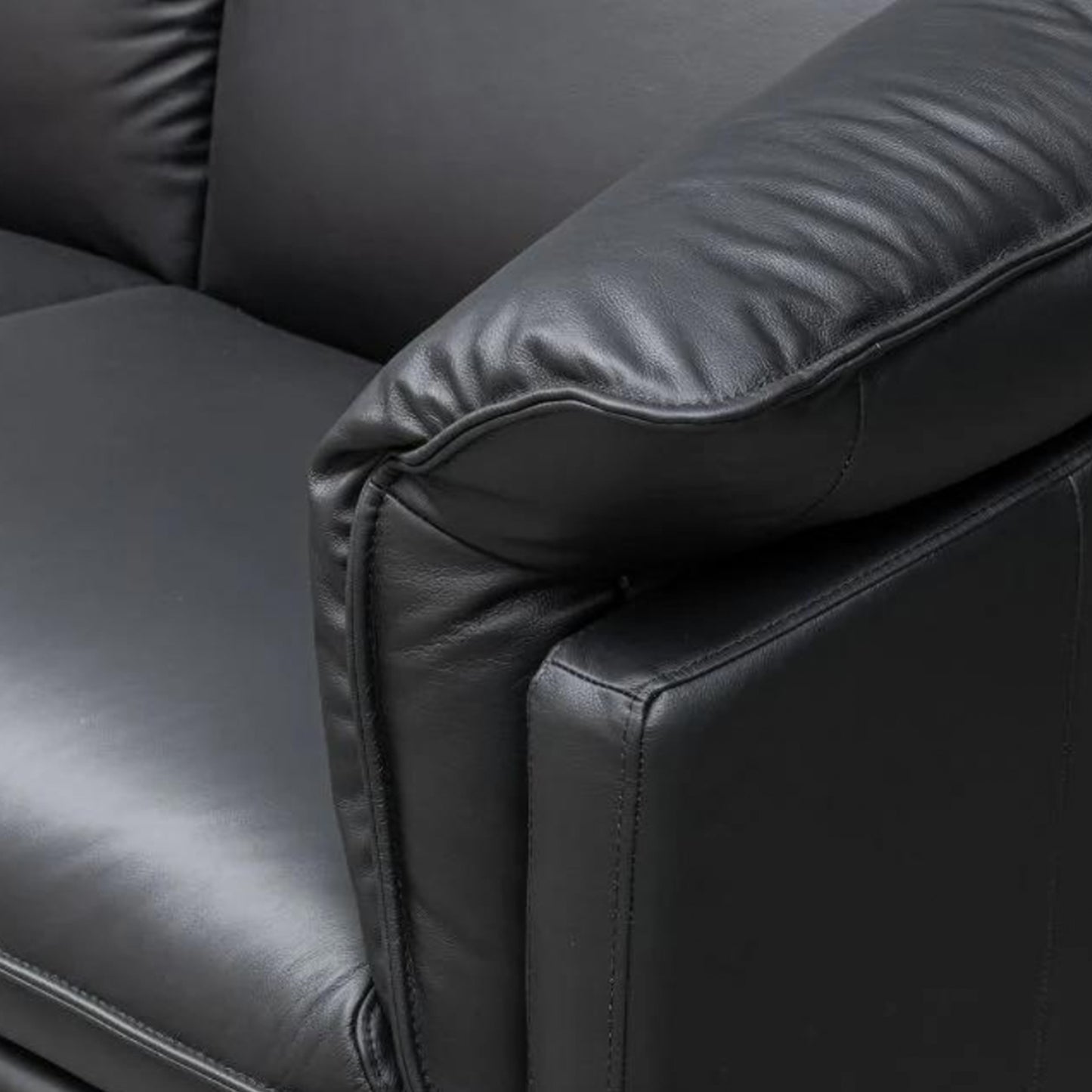 Close-up of Klaussner Dolce sofa's refined deep stitching and premium black leather texture for Comfort Design Furniture