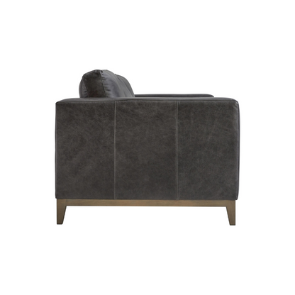Close-up of the Bernhardt Noel 3-Seater Sofa showing dark leather upholstery with track arm detail and tapered wooden leg