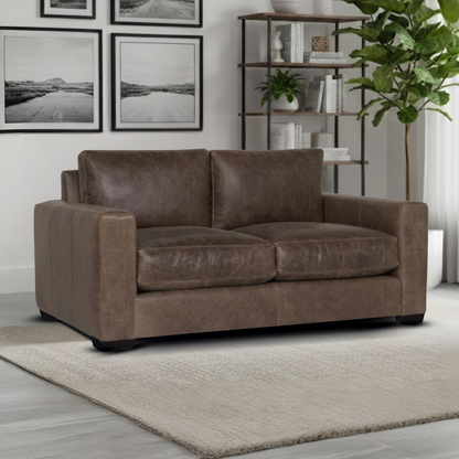 Leather loveseat in room setting showing scale and placement for comfort design furniture