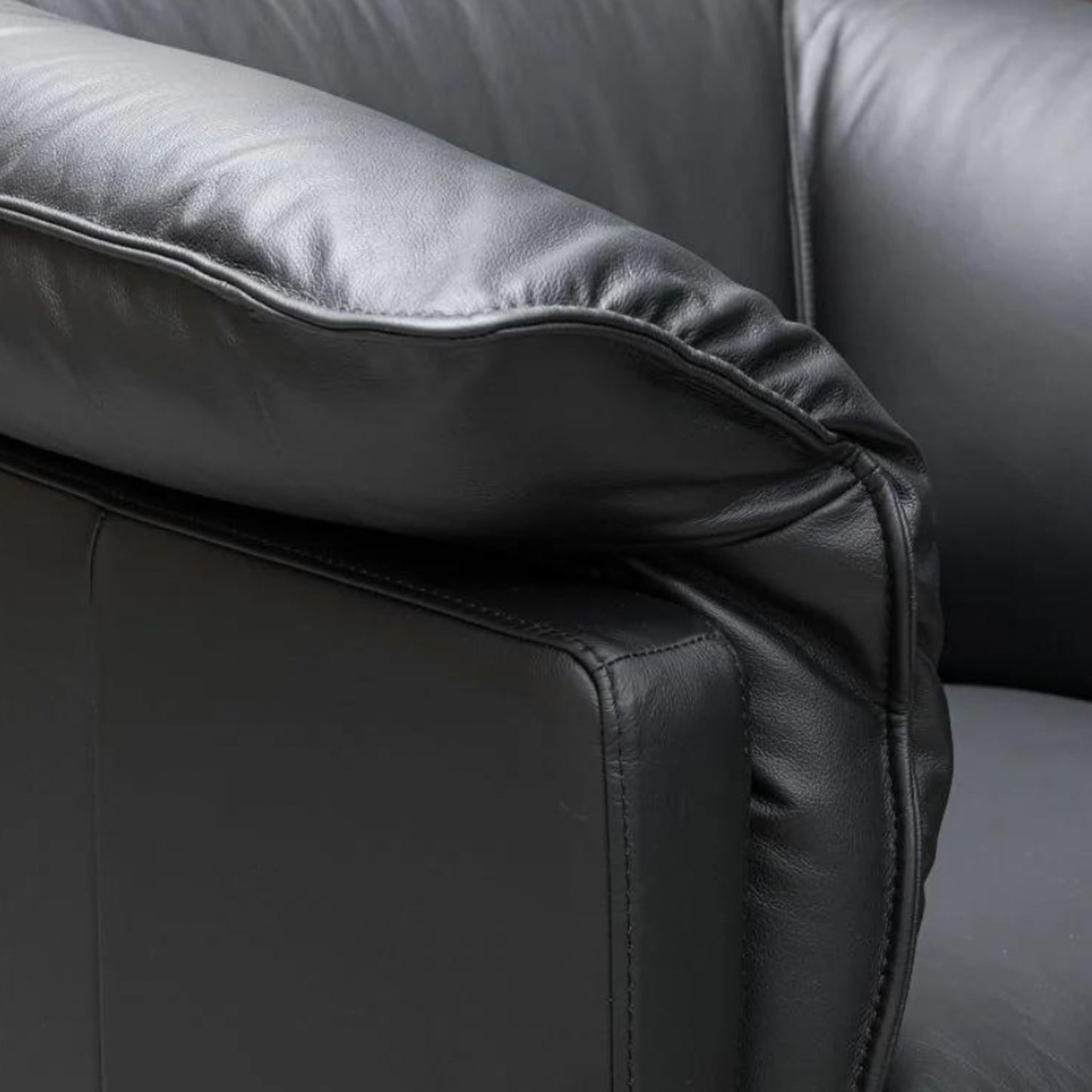 Close-up of Klaussner Dolce sofa's refined deep stitching and premium black leather texture for Comfort Design Furniture
