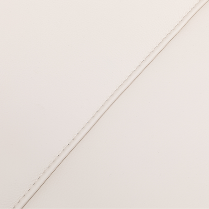 Close-up view of beige leather upholstery with fine stitching detail on the Klaussner Capri Power Reclining Chair.